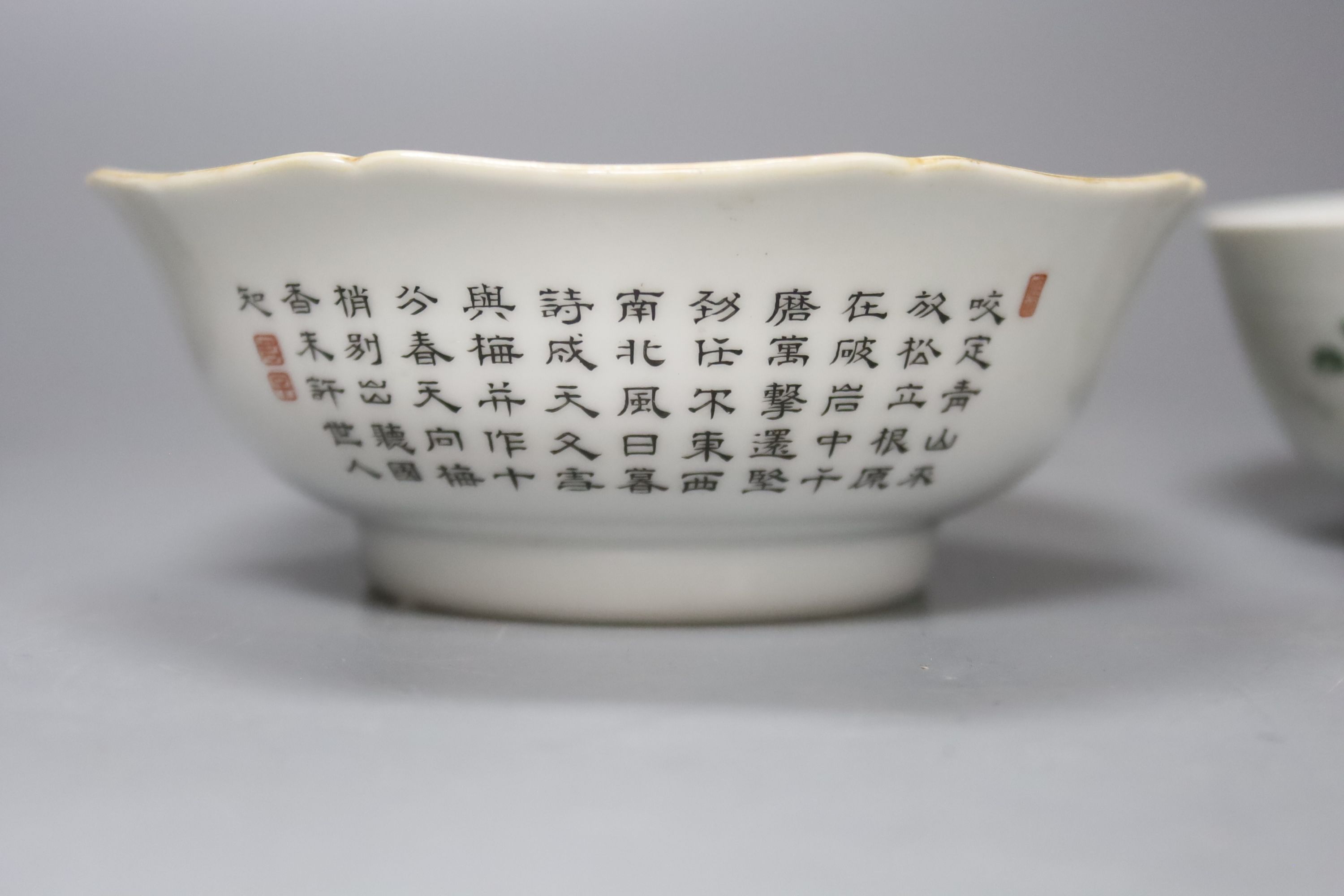 Two Chinese famille rose bowls together with a similar blue and white bowl, largest diameter 14cm